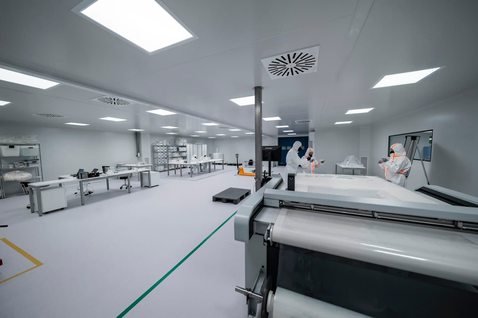 Cleanroom with staff in protective suits